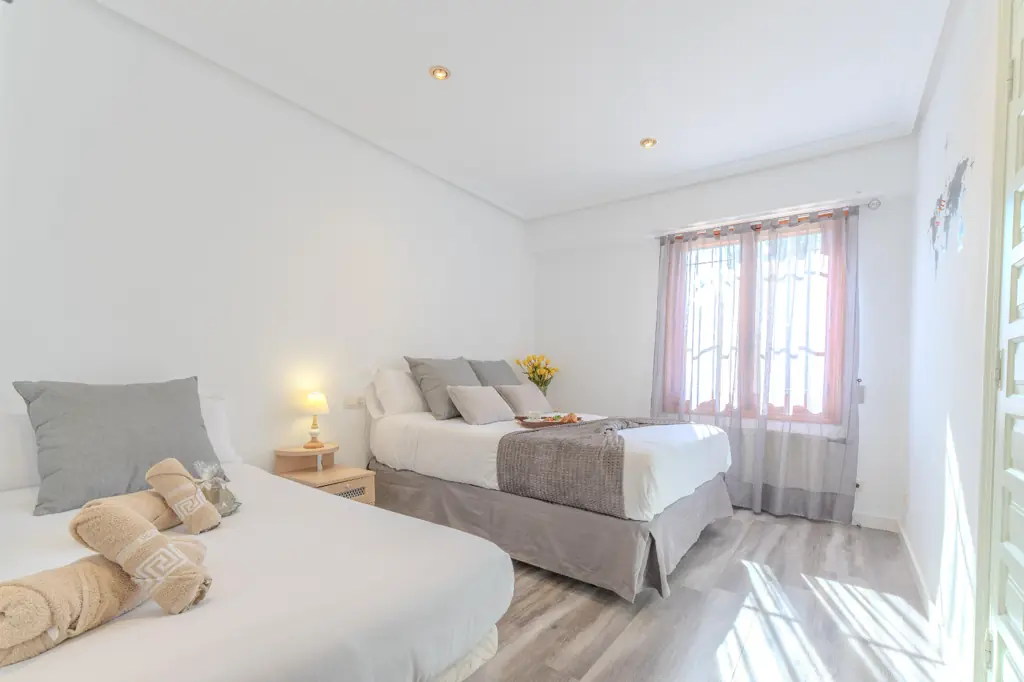 Spacious bedroom with a double bed at La Cova House